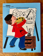 boy painting puzzle